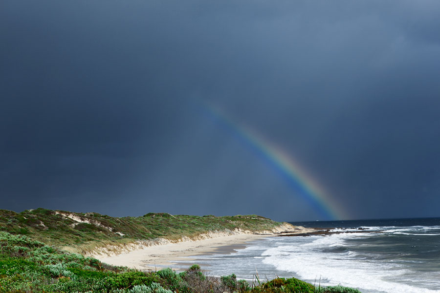Rainbow and stormy skies and beach, Western Australia travel photography